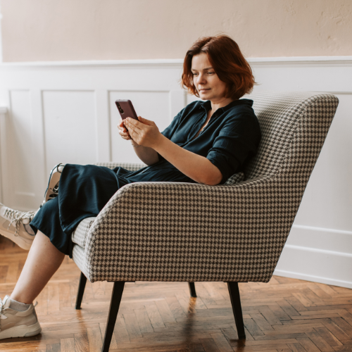 woman scrolling on phone